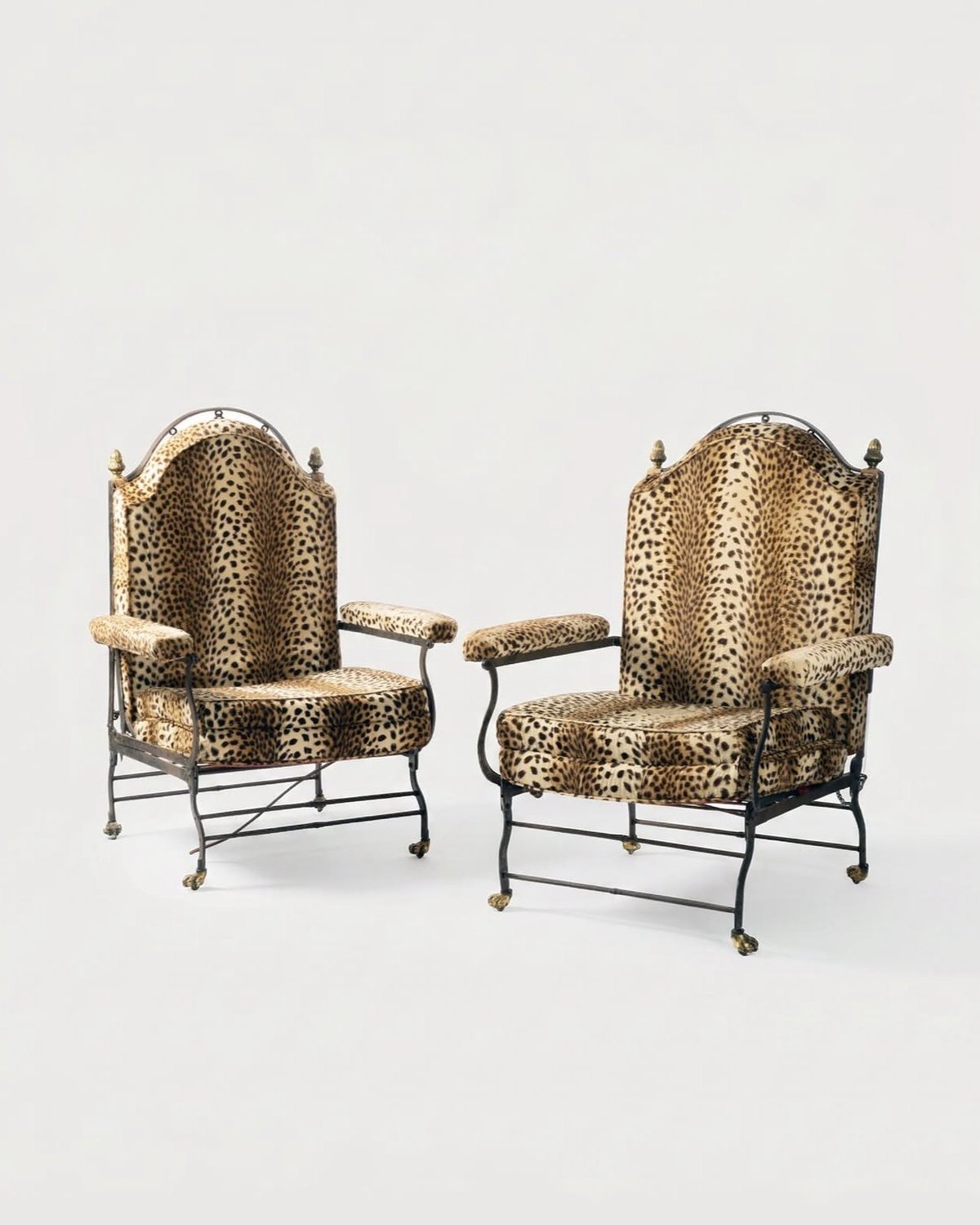 Pair of wrought iron armchairs upholstered in leopard velvet